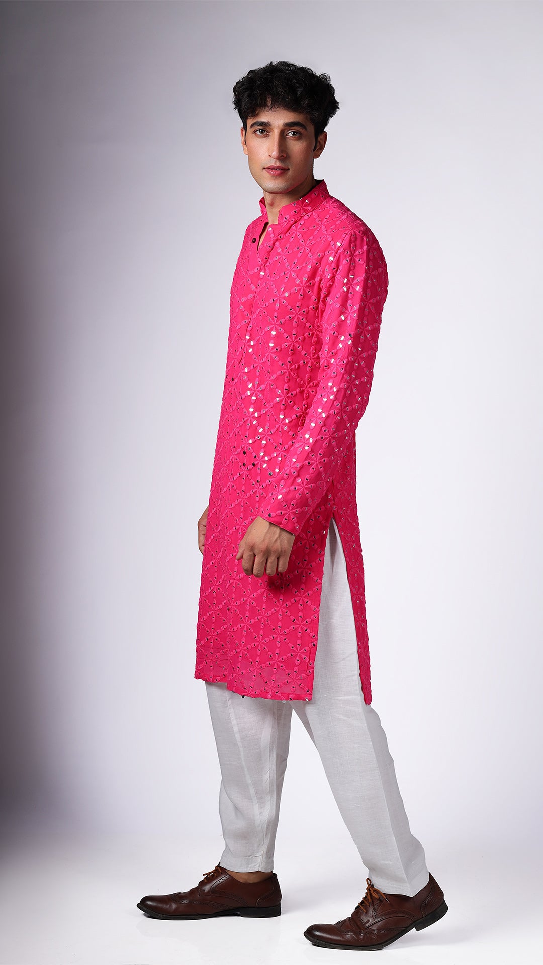 Side view of Hot Pink Kurta with Sequin Embellishments, worn with salwar and tan Oxford shoes