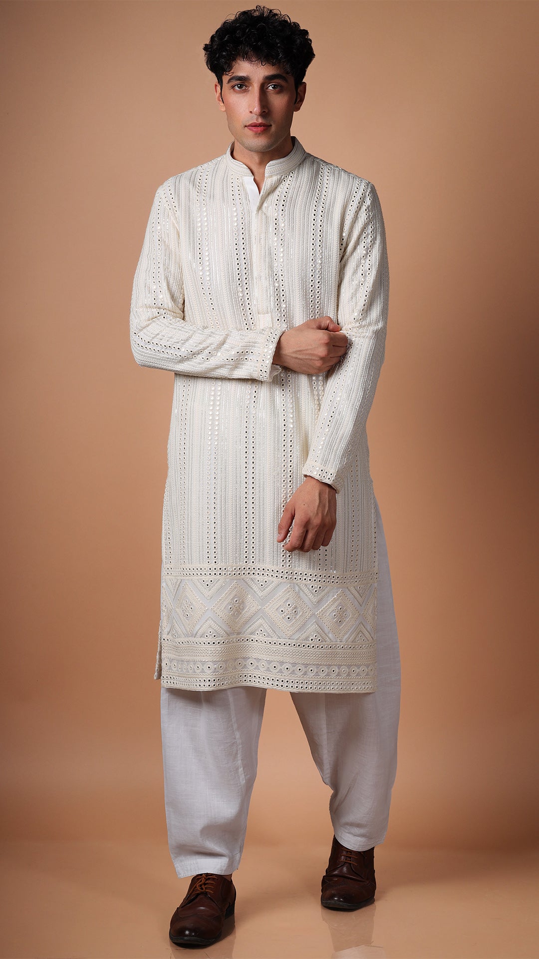 Model in Off White Kurta with Vertical Panel Mirror Work by BWO, paired with white patiala and tan Oxford shoes