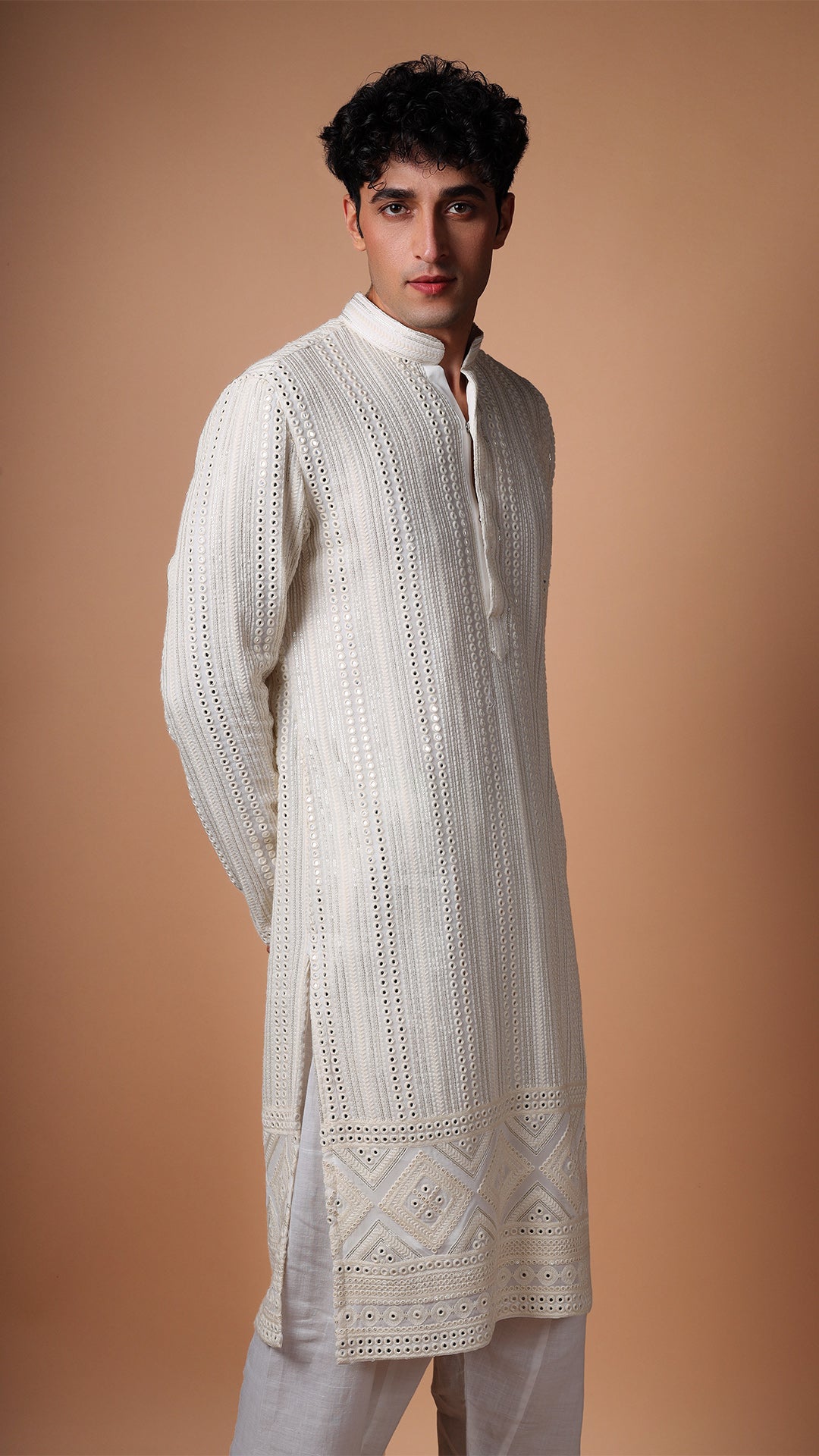 Close-up of Off White Kurta with Vertical Panel Mirror Work, highlighting intricate details. Model styled with white patiala
