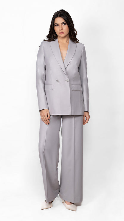 A contemporary light grey suit featuring a double-breasted blazer with a 2-button closure and perfectly tailored trousers for a sleek, refined look.