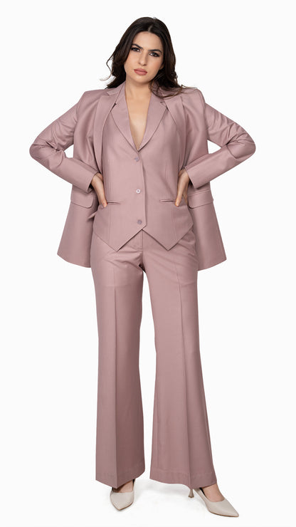 A chic three-piece suit in onion pink, featuring a sharp blazer, tailored waistcoat, and bell-bottom pants. A modern take on classic tailoring.

