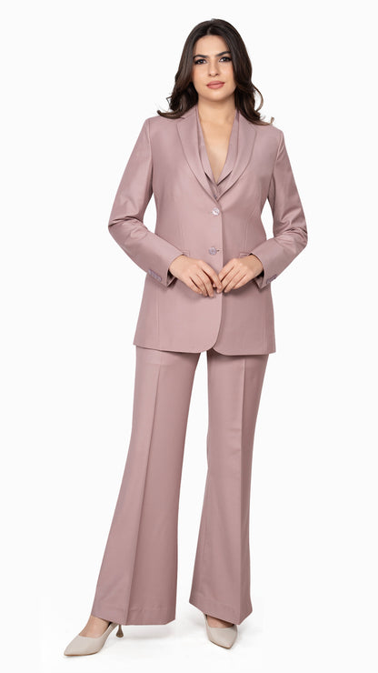 A polished two-piece suit featuring a sharp pink blazer and flared trousers, designed for confident, fashion-forward women.

