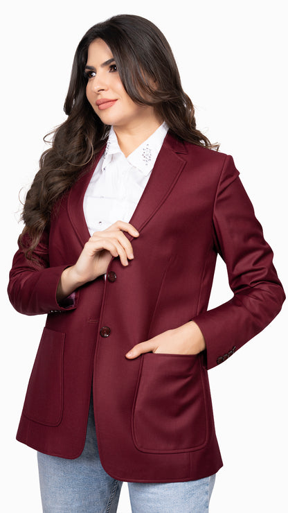 A sophisticated maroon blazer featuring a classic notch lapel with peak stitching and statement patch pockets for a modern touch.