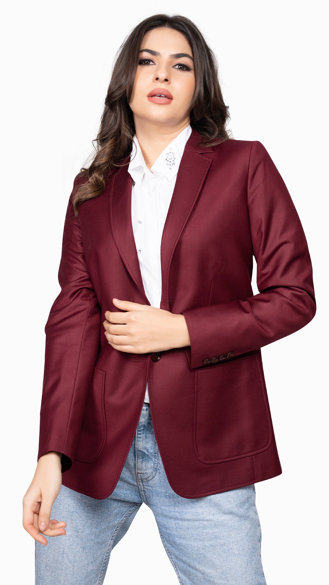 A refined maroon blazer with peak stitch detailing and patch pockets, creating a perfect blend of structure and ease.

