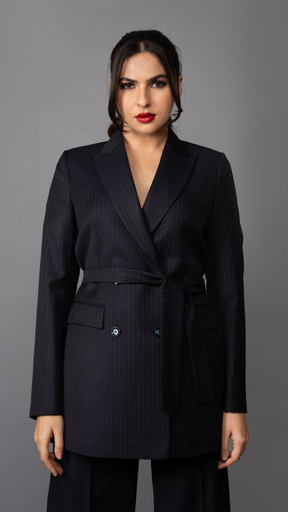 A stylish blue pinstripe blazer with a flattering belted waist, structured peak lapel, and tailored fit for a commanding look.