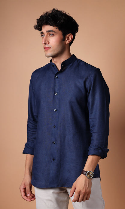 Model posing in a navy blue linen shirt, depicting a strong and assertive look.